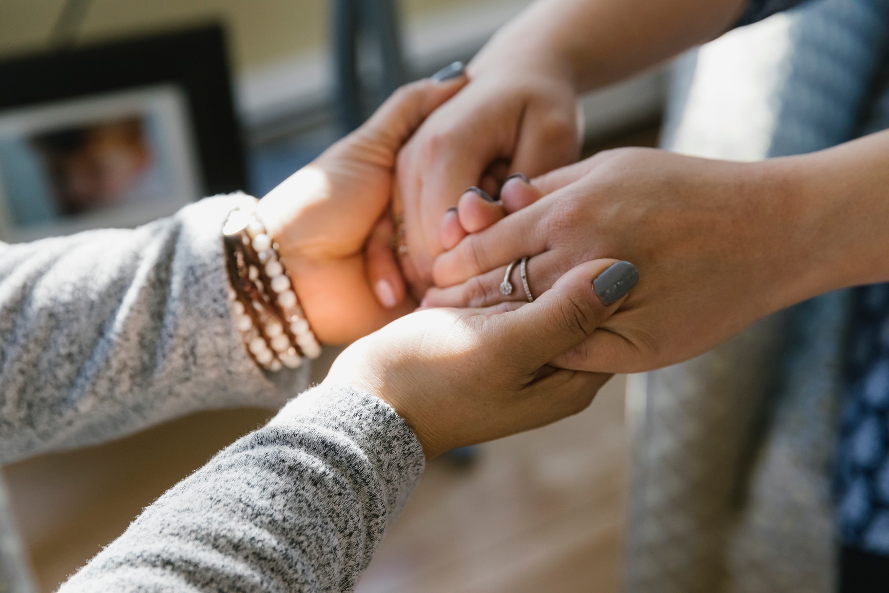 Birth doula holding hands